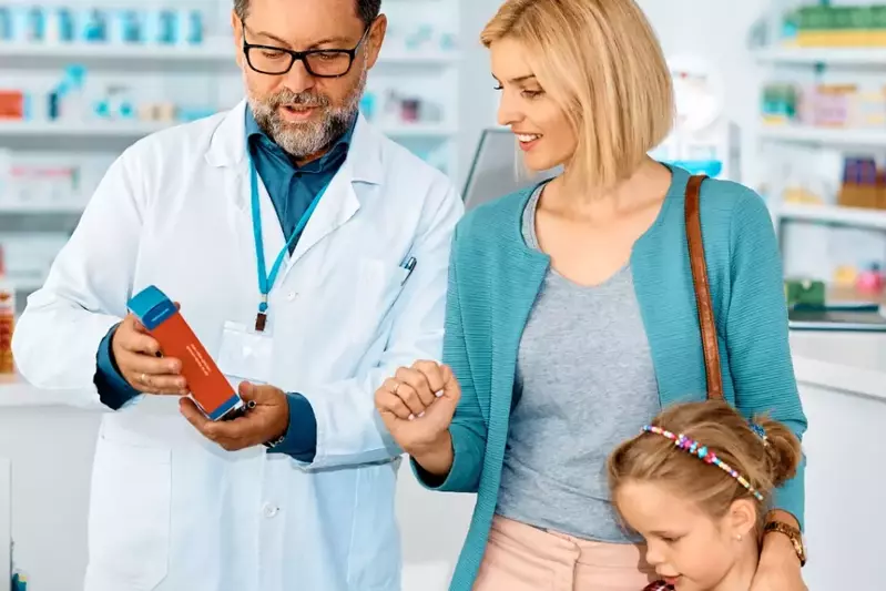 pharmacist with mom and daughter