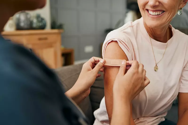 pharmacist giving a vaccine