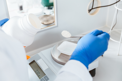 pharmacist working in compounding lab