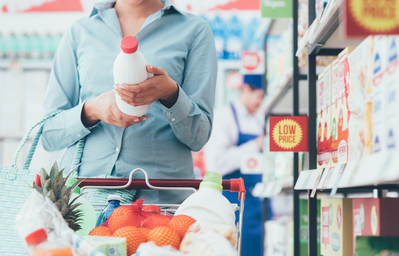 woman reading food label